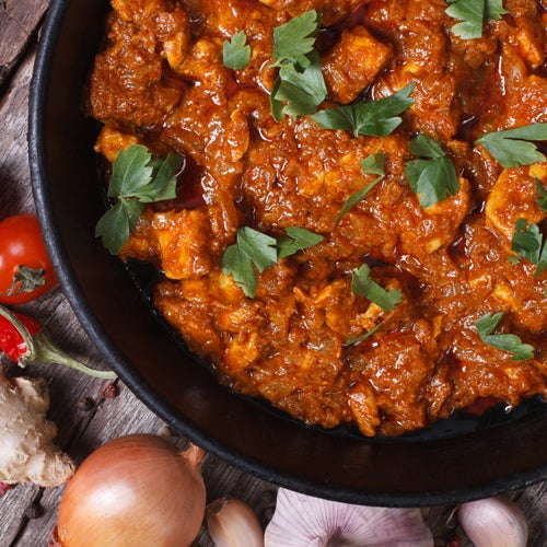 Poulet et légumes indiens avec riz au cumin grillé